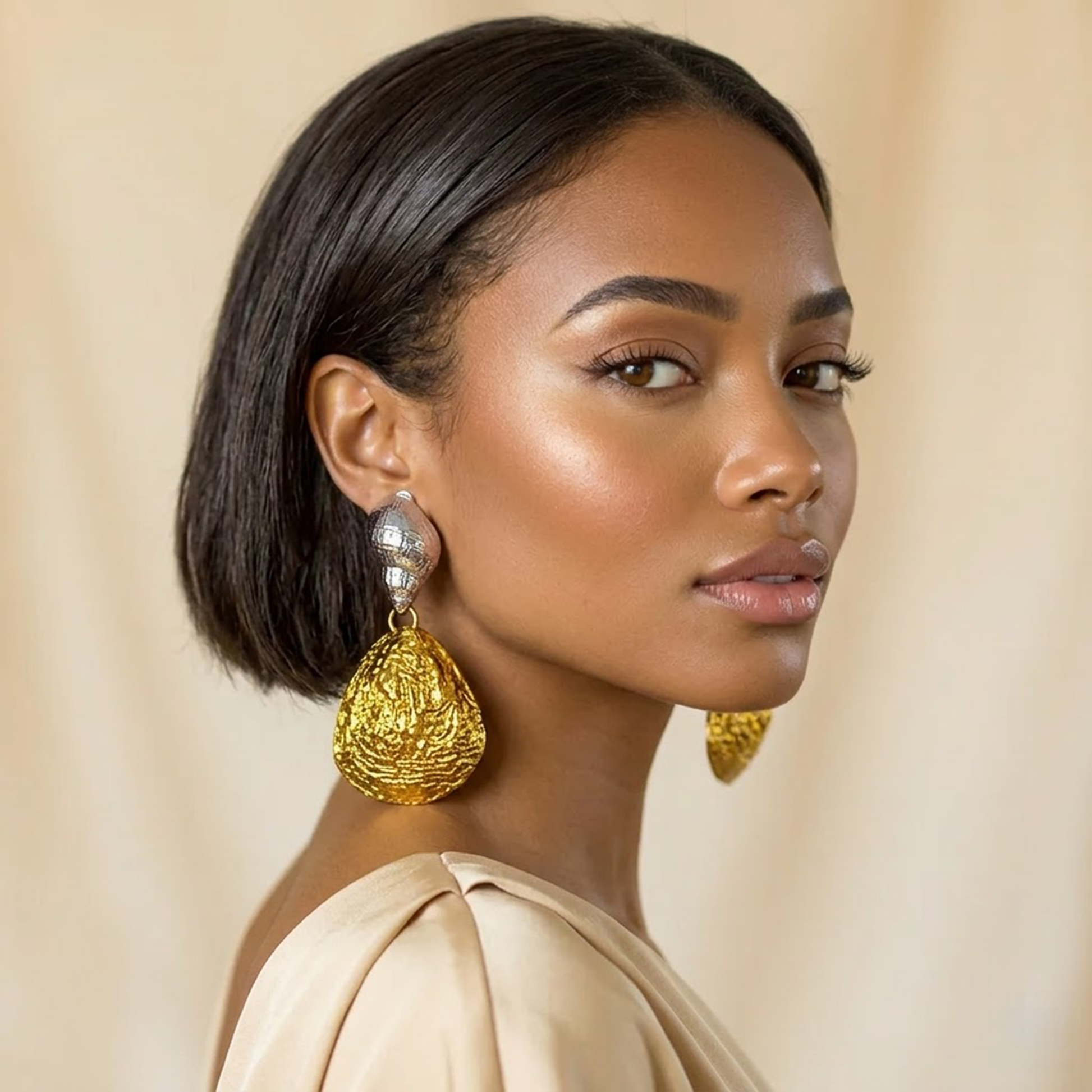 Shell Earrings — silver + gold organic shell drop earrings on model, statement shell handmade jewelry for party