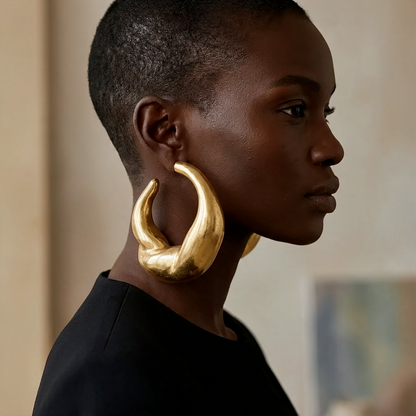 Lava Hoops gold African statement hoop earrings worn on the ear